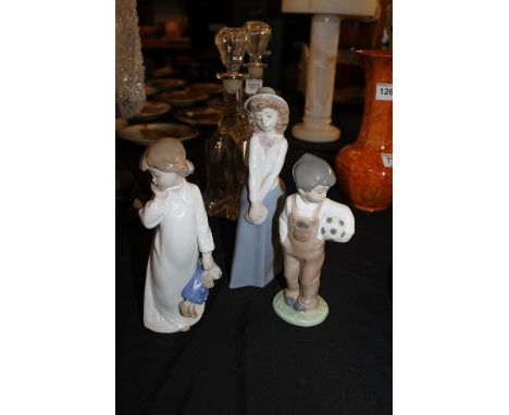 Collection of three Nao figures including boy with football