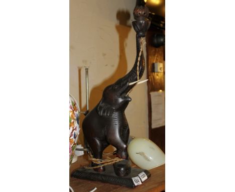 Table lamp in the form of a carved wooden elephant with tusks