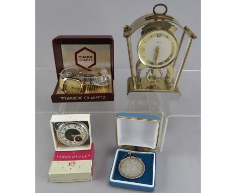 An Ingersoll Triumph pocket watch, with original guarantee, in box, together with a Timex wristwatch, a Schatz 8 day clock, a