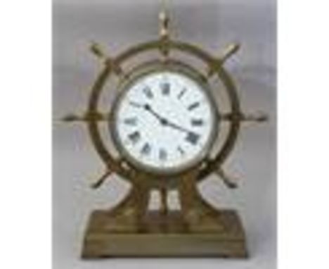 Charles Frodsham & Co, Paris, a late 19th Century brass bracket clock of marine interest, in the form of a ship steering whee