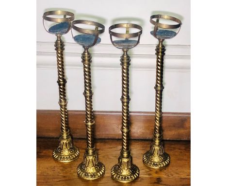 A set of four (or two pair of) Ecclesiastical brass church stands, in the manner of Hardman & Co, half globe top on turned su