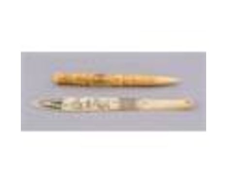 A George III ivory bobbin, turned, carved and with dot inlay, length 15cm and a tribal bone letter opener decorated with a st