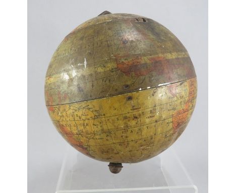 A tin biscuit barrel in the form of a globe. With hinged lid and standing on four feet.Some wear and damage. 