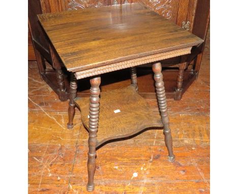 An early twentieth century oak square side table with turned legs and lower shelf. 46 w, 62 cm tall. (1)