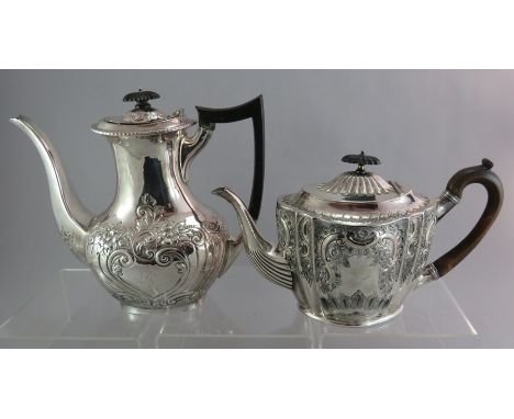 A silver hallmarked teapot and coffeepot, one with ebonised handle. 1480g