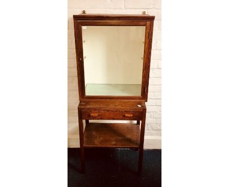 A 20th Century mahogany glazed display cabinet with two glass shelves together with a similar oak hall table with single draw