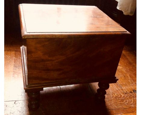 A 19 century mahogany commode, rectangular top hinged lid revealing a pine inlay over a ceramic commode, raised on turned sup