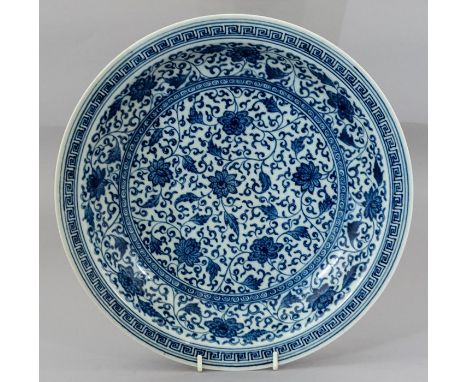 A Chinese blue and white charger, Greek key border containing scrolling foliage, blue seal Qianlong seal mark, diameter 32cmC