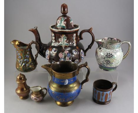 A group of lustre wares to include jugs, mugs, a pepper pot, a Grays jug and a large Barge ware teapot and cover. (7)Some dam