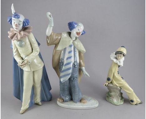 A group of three Nao porcelain clown figures. Factory marks to bases. (3)Condition: In good overall condition. 