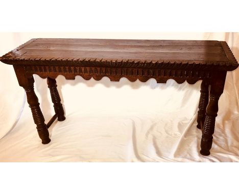 A Jacobean revival oak console table, a 19th century incorporating  early oak, rectangular top with arch carving to the friez