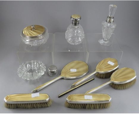 A silver and guilloche enamel Mappin &amp; Webb dressing table set, to include cut glass powder jar (London 1935), brushes, h