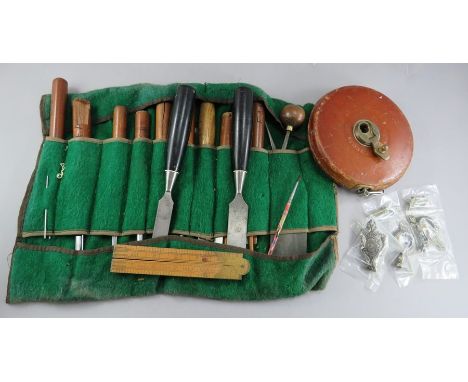 A group of tools to include a folding rule, wood working chisels and drawer furniture. (q)