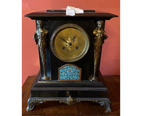 A French ebonised marble, gilt metal and champleve mantel clock, rectangular moulded end top, above a circular 5 inch brass d