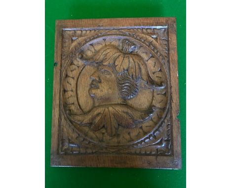 A 16th Century rectangular oak panel, probably an inset for room panelling, carved in relief with a profile portrait of a gen