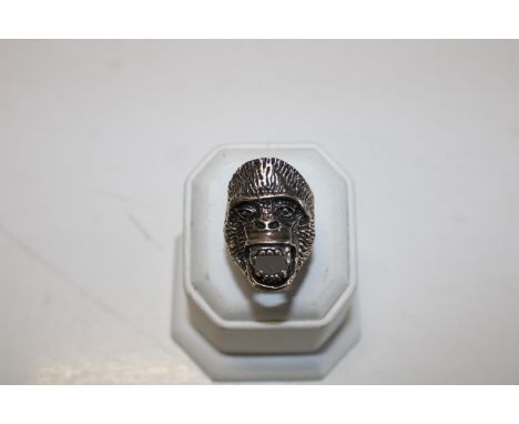 A large 925 silver ring in the form of a gorillas head 