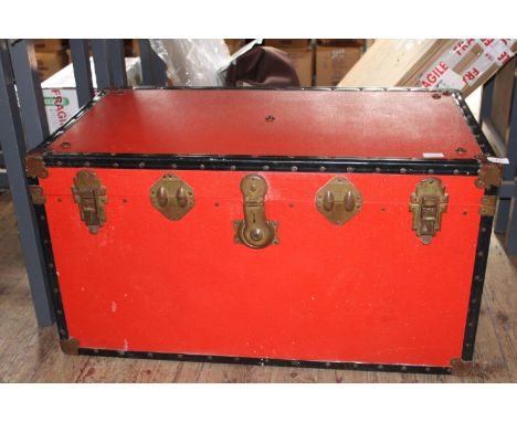 A vintage red travel trunk collection only 