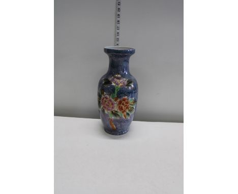 A ceramic vase with lustre floral decoration 