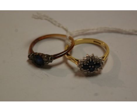 An 18ct gold sapphire and diamond flower head cluster ring, and one other yellow gold sapphire and diamond dress ring (2)