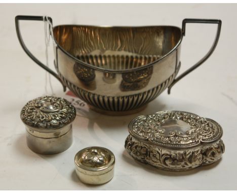 A silver twin handled sugar, two silver and embossed pill / snuff boxes, and one other modern metal pill box (4) 