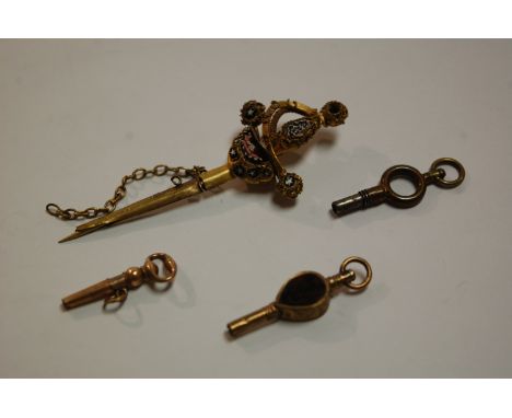 A gilt metal and enamel set pendant in the form of a sword and scabbard together with a Victorian bloodstone set fob watch ke