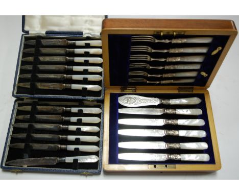 Two cased sets of six silver plated and mother of pearl handled butter knives; and a walnut cased six place setting of mother