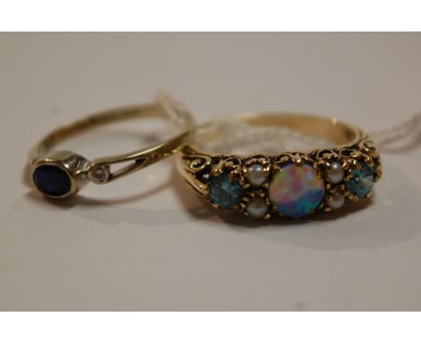An Edwardian style 9ct gold opal seed pearl and blue topaz set dress ring together with a 9ct gold sapphire and diamond ring 