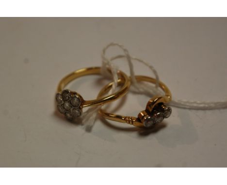 An 18ct gold diamond flower head cluster ring, and one other diamond three stone ring  (2)