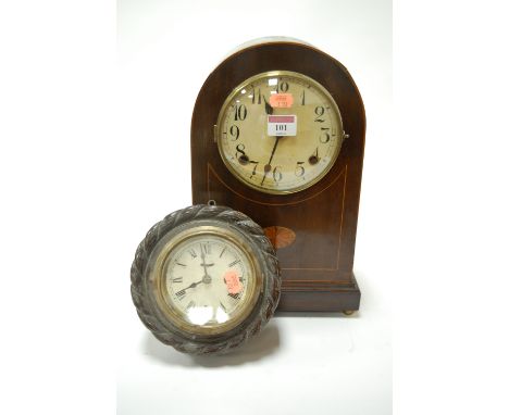 An Edwardian mahogany and inlaid dome-top mantel clock; and a small wooden cased ships clock (2)