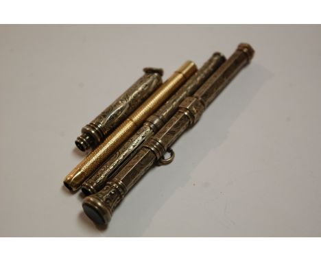An engine turned gilt metal propelling pencil and three silver and engraved propelling pencils (4)