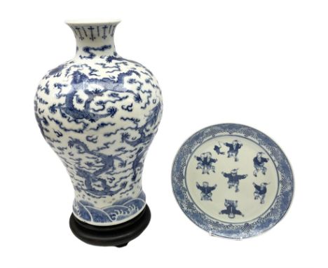 20th century Chinese blue and white vase of inverted baluster form, decorated with dragons chasing a flaming pearl amidst clo