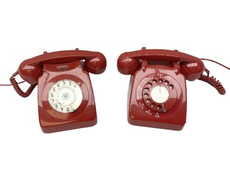Two mid 19th century red telephones with rotary dials, comprising example marked G.P.O Batch Sampled 8532 706L AEG 67/2A, wit