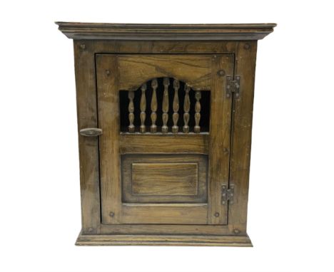 Oak dole cupboard / food hutch, the hinged panelled door with turned spindles enclosing a single shelf interior, H52cm D17cm 