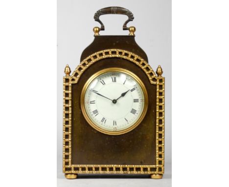 An early 20th century French mantel clock, having arched top with burnished brass case and attached gilt metal decoration, ho