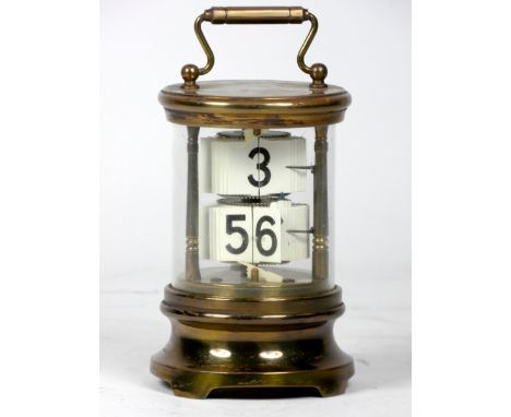 A U.S.A 'Ever-Ready' ticket desk clock, the brass case of cylindrical form with moulded top and bottom separated by three tur
