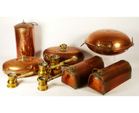 Four various copper bed warmers, a set of four graduated brass pourers and two other copper vessels. 