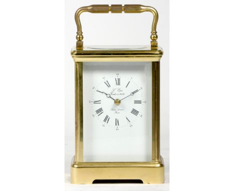 A French brass carriage clock, of rectangular form, the enamelled dial with Roman numerals and inscribed Sainte Luxanne Franc