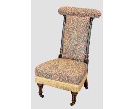 A Victorian&nbsp;prie dieu or Prayer chair chair, having ebonised reeded supports with tapestry upholstered seat and backrest