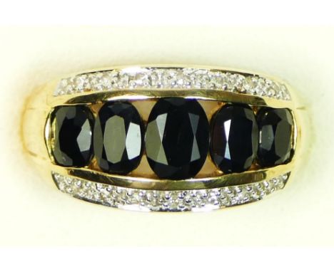 A 9ct gold, graduated sapphire and diamond panel ring, P, 5.3gm 