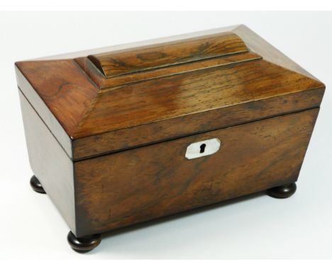 A 19th century rosewood tea caddy, sarcophagus shaped with hinged domed cover revealing two lidded compartments, mother of pe