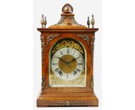 A Victorian mahogany and burr walnut German bracket clock, the bell-top case above four urn finials and moulded pediment, wit