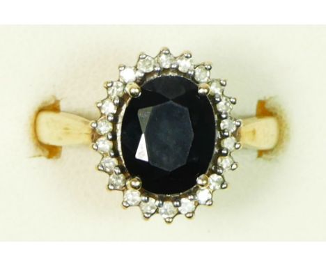 A 9ct gold sapphire, 10 x 8mm, and diamond cluster ring, O, 4.7gm 