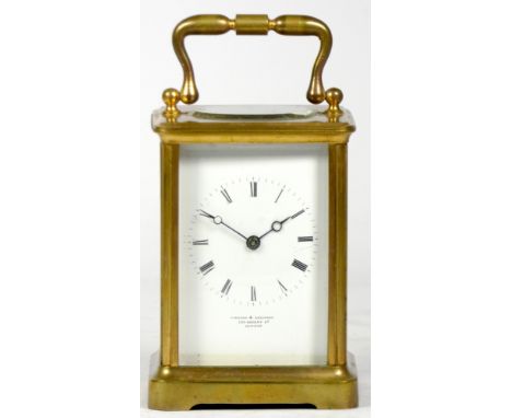 A French carriage clock, early 20th century of oval form, the white enamelled dial with Roman numerals and inscribed Vieyres 