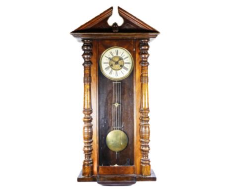 A late 19th century walnut Vienna style wall clock, the movement striking on a gong, pendulum, key, 106cm 