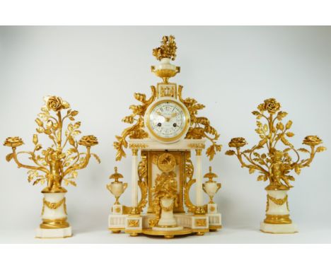 Planchon, Paris, an impressive French late 19th century gilt brass and white marble clock garniture, the architectural case w