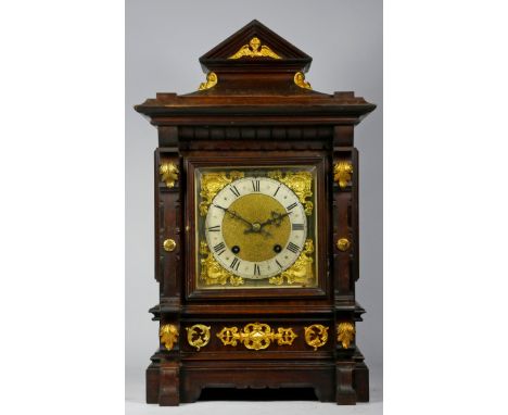 A late 19th early 20th Century German mahogany cased bracket clock, the break-arched dial with silvered chapter ring having R