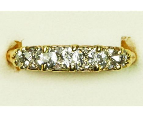 A Victorian 18ct gold and old cut brilliant five stone diamond ring, unhallmarked, carved claw set with graduated stones, ros