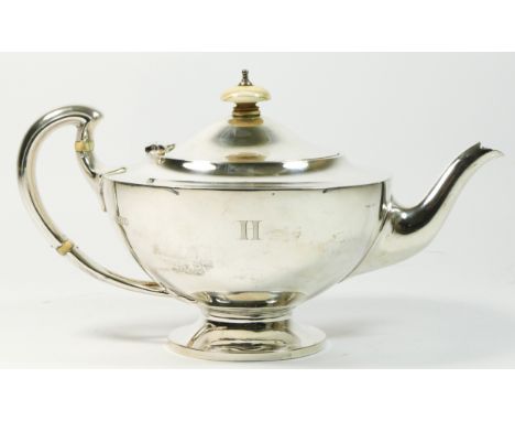 A silver teapot by Edward Barnard & Sons Ltd., London 1919, the handle with splayed trefoil terminal, initialled H, height 13