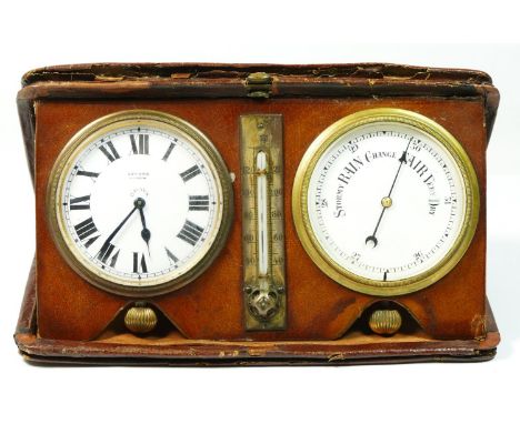 An Edwardian travelling desk set, comprising an eight day clock, the white enamel dial with Edward, Glasgow retailers name, b