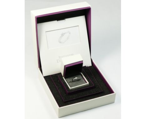 A 9ct white gold single stone brilliant cut diamond ring, stated weight 0.16cts with 0.06cts to the shoulders, Beaverbrooks c